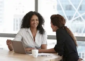 Women talking in an office